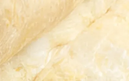 Glass wool insulation batt laid between attic framing